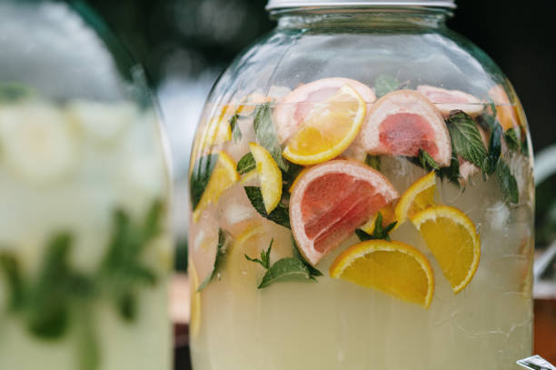 A large jar with water infused with mint, orange and grapefruit